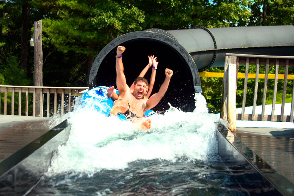 Guests Emerge From Black Vortex Slide